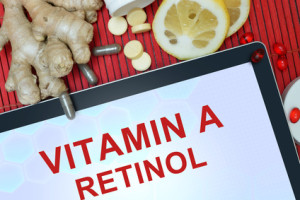Tablet with words Retinol (vitamin A). Healthy eating.